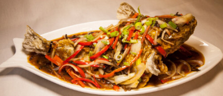 Deep fried whole blue cod with savoury sauce